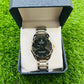Watch in a blue box on a green grass background